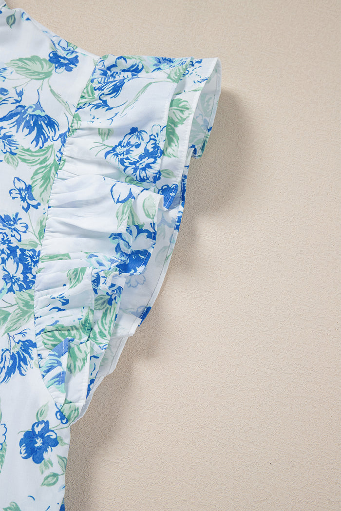 Chemise boutonnée à volants et imprimé floral bleu ciel-A WOMAN WE LOVE