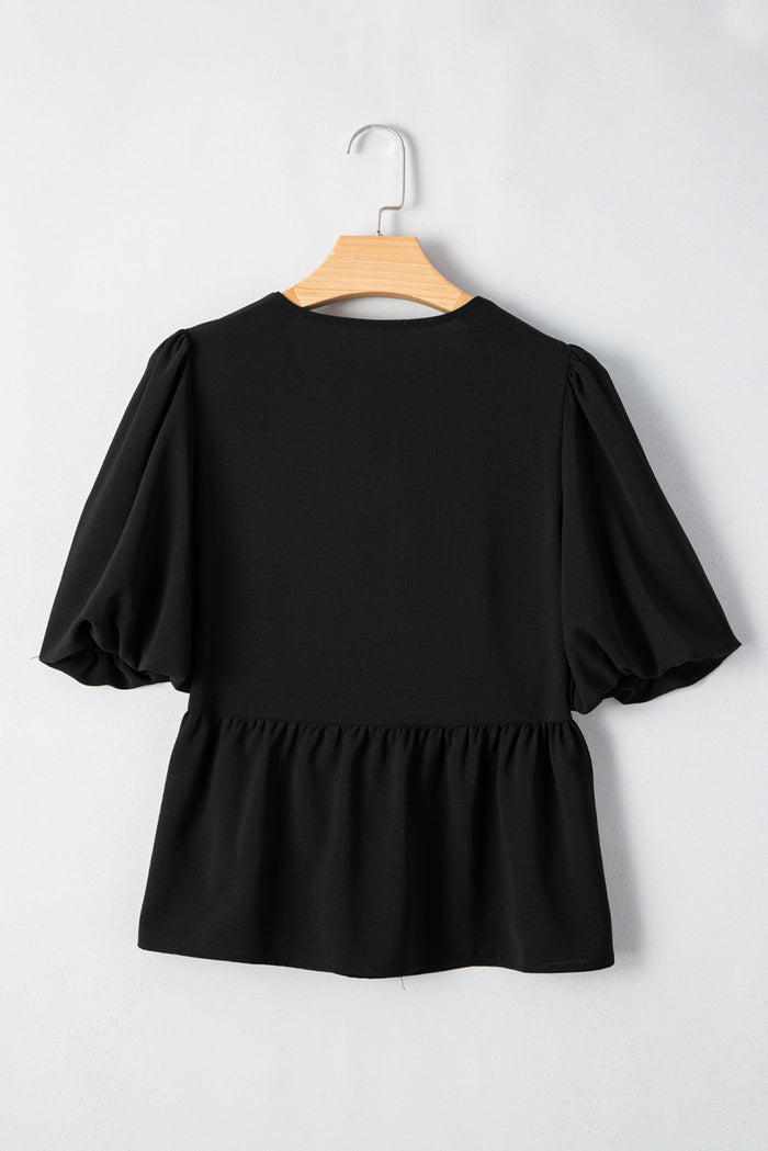 Chemise péplum noire à manches bouffantes *