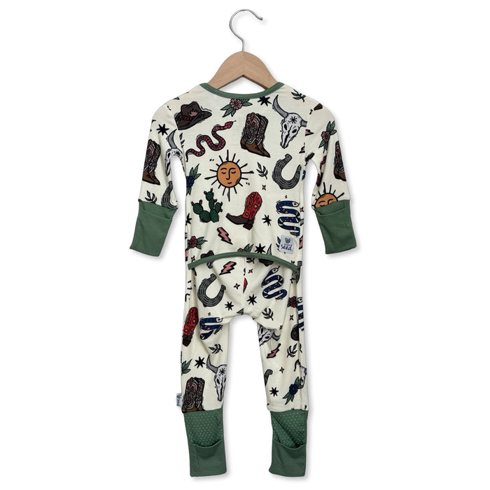 Children's onesie with cowboy-themed pattern on a hanger against a white background