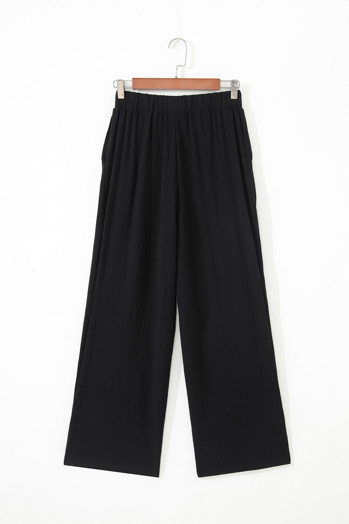 Pantalon ample texturé de couleur unie
