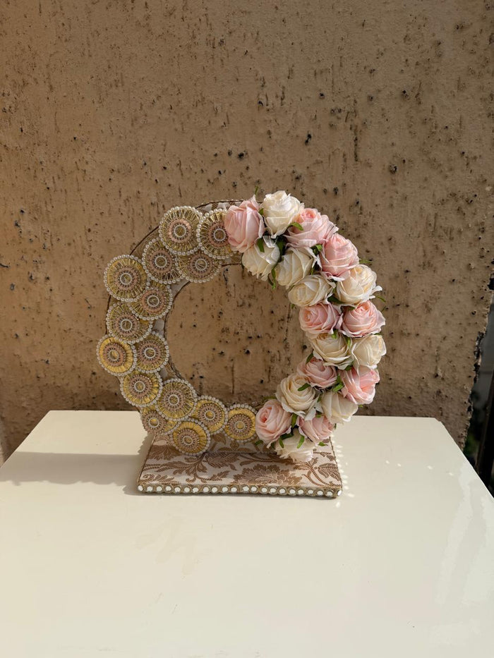 Premsons mini floral chakri stand with rose garland and circular patterned frame
