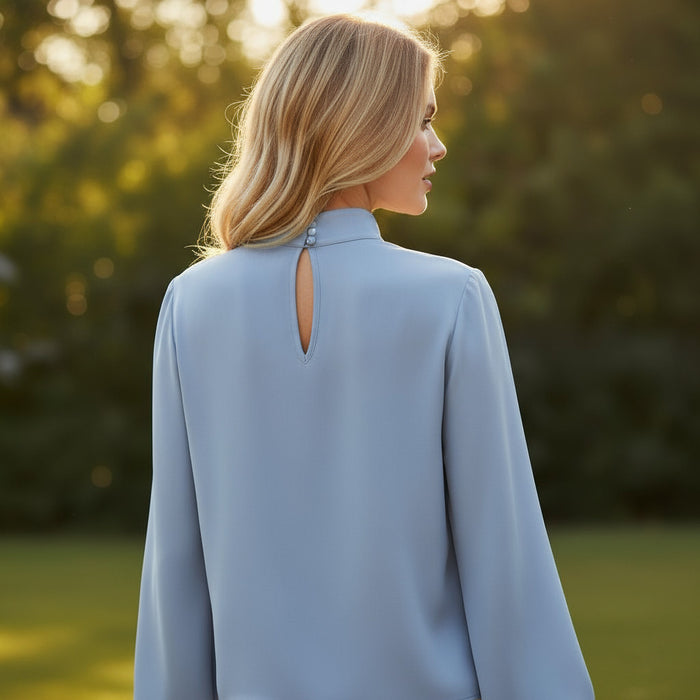 Blouse asymétrique plissée à col roulé *