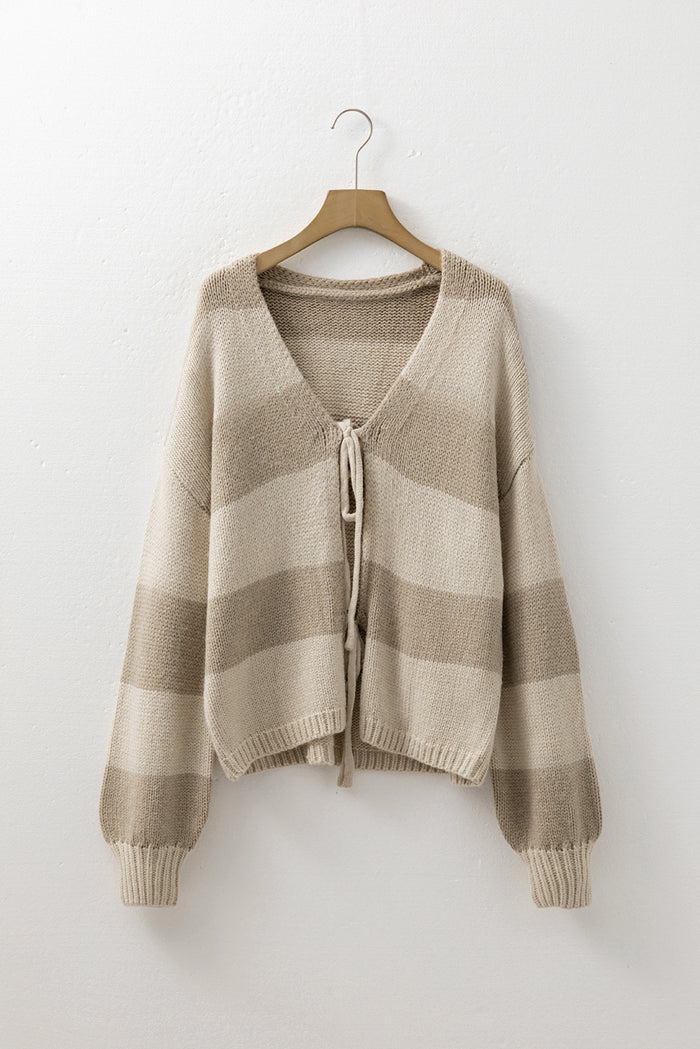 Cardigan beige rayé en tricot brossé avec nœud papillon sur le devant