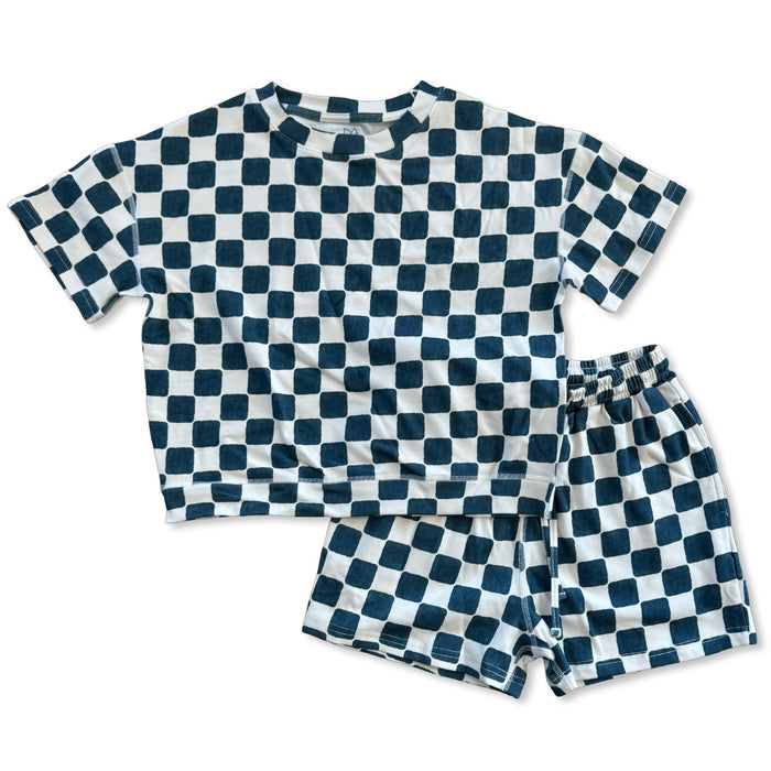 Checkered shirt and shorts set on a white background