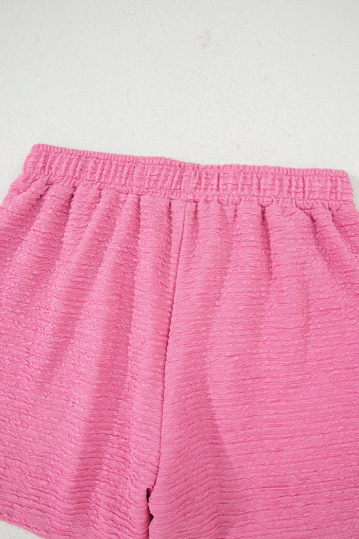 Ensemble t-shirt et short texturé rose à col en V
