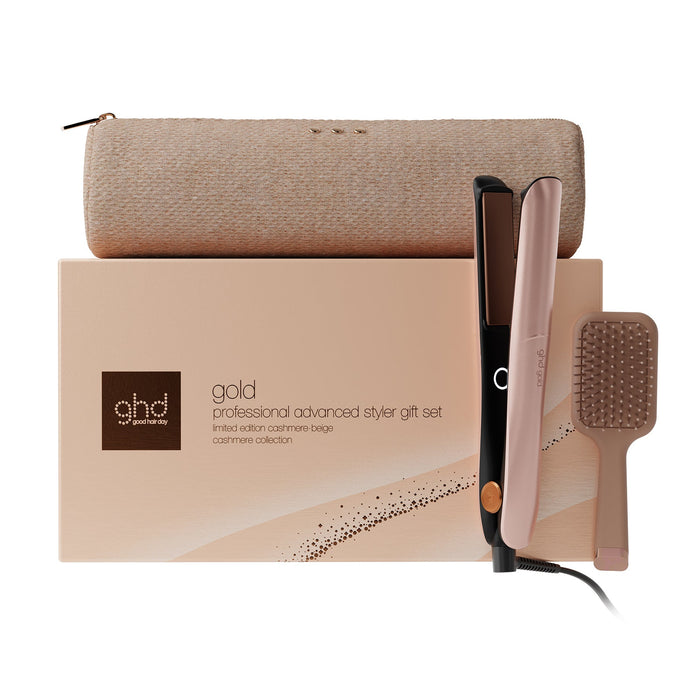 Ghds gold professional advanced stylist gift set featuring a flat iron, a hairbrush, and a storage pouch arranged in front of their branded packaging box on a white background.