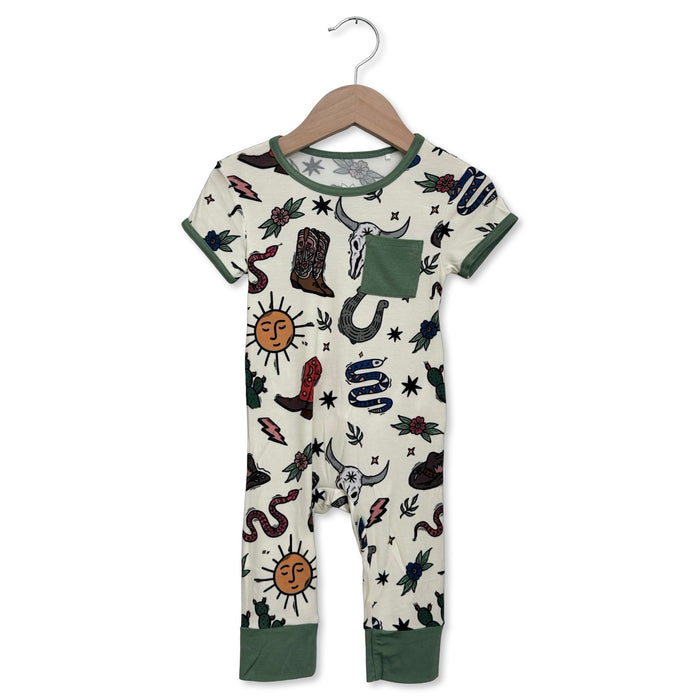 Children's onesie with tattoo-like design on a hanger against a white background