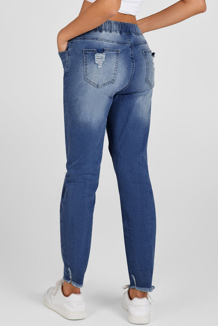 Jean bleu foncé à taille élastique, jambe droite, ourlet brut détruit
