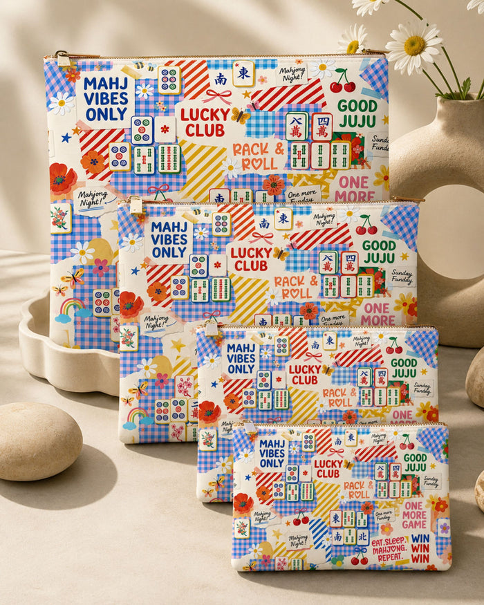 Vegan leather zipper pouch with multicolor mahjong tile print, blue base, rectangular bag