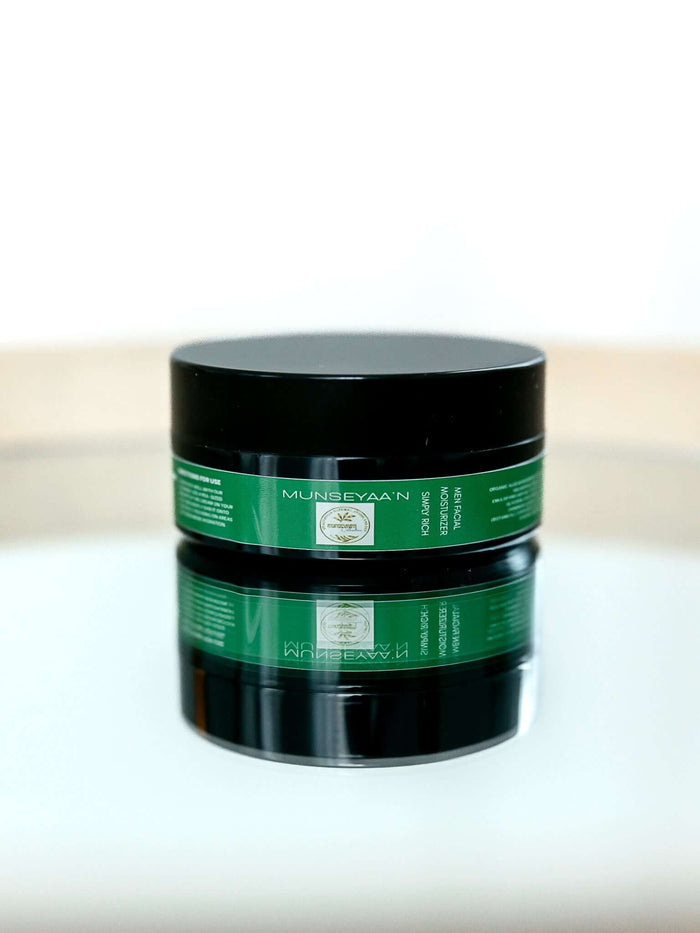 Jar of men’s facial moisturizing cream with organic botanical ingredients for deep hydration and antioxidant protection