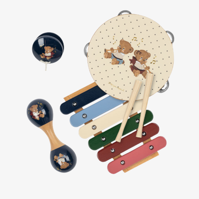 A baby toy set featuring a wooden xylophone with colorful keys, a round tambourine with teddy bear illustrations, and two maracas, all decorated with matching navy blue bear graphics, arranged on a light gray background.