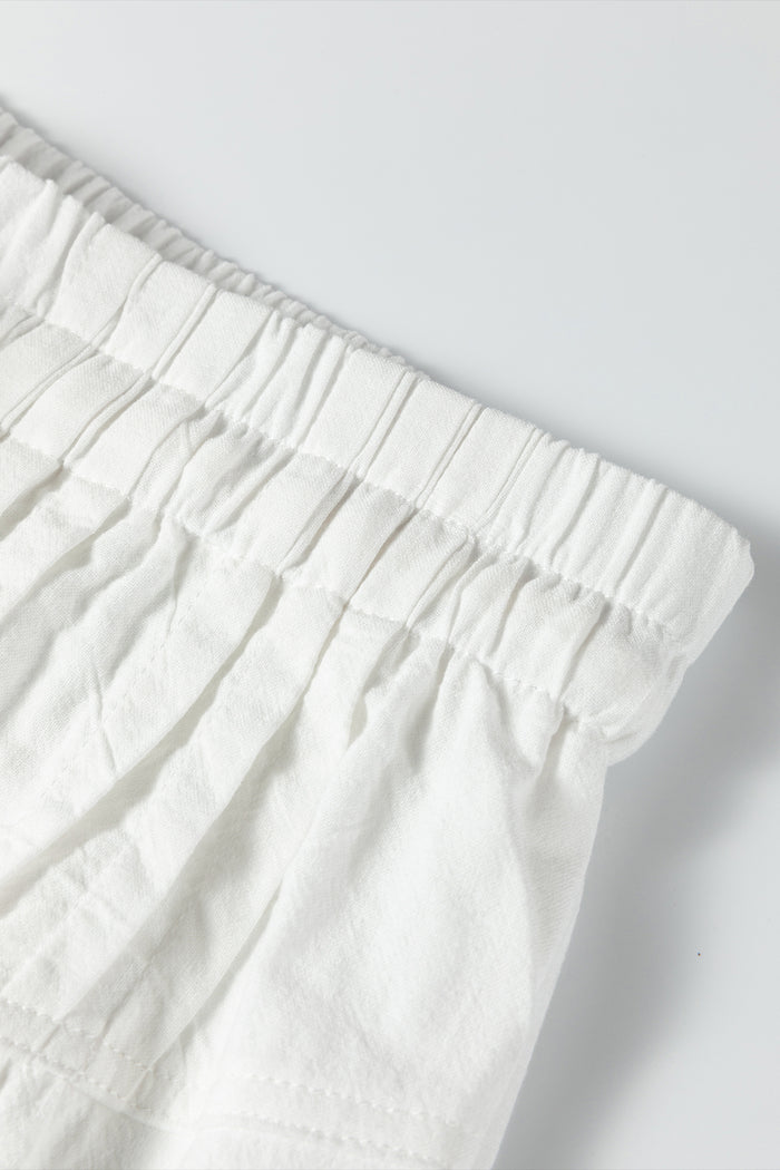 Pantalon à jambe large avec cordon de serrage couleur crème