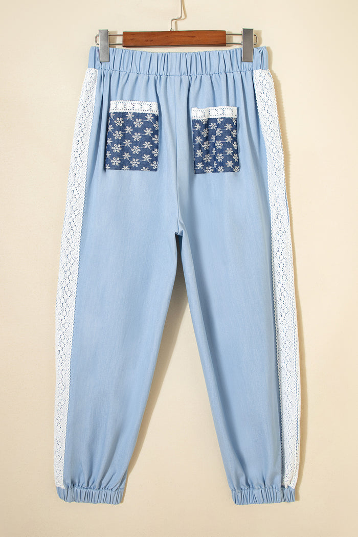 Pantalon ample plissé à jambe large et poche plaquée florale