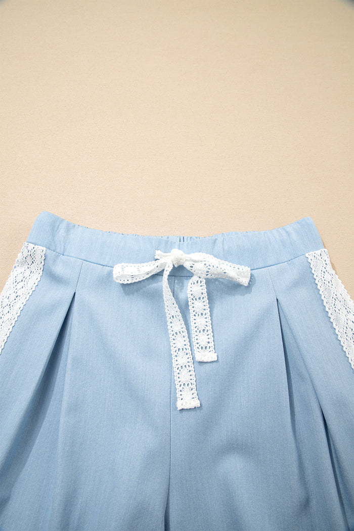 Pantalon ample plissé à jambe large et poche plaquée florale