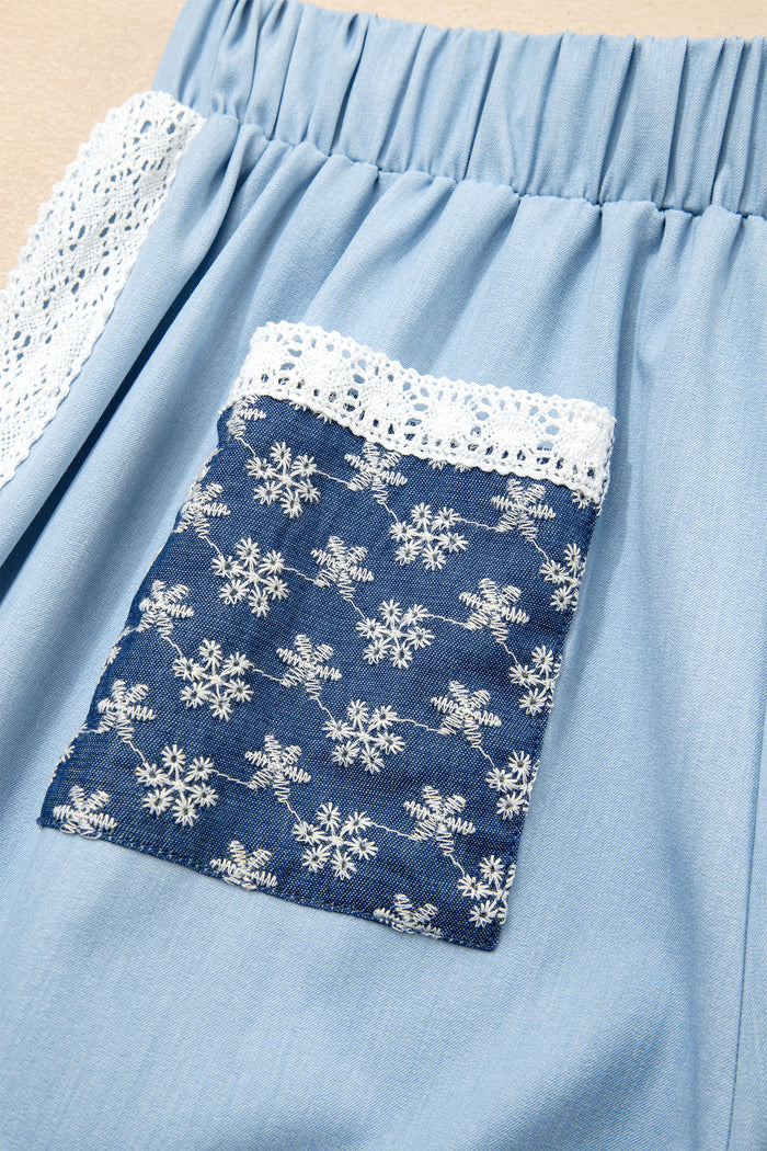 Pantalon ample plissé à jambe large et poche plaquée florale