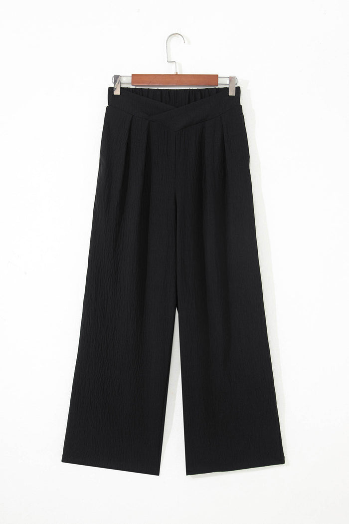 Pantalon ample texturé de couleur unie