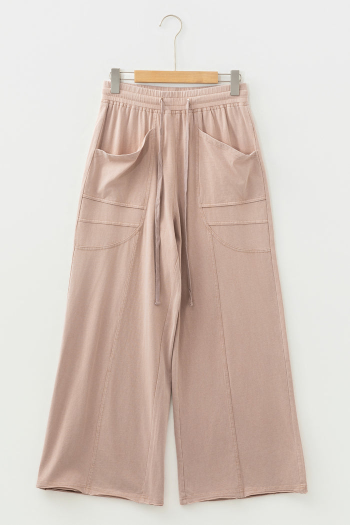 Pantalon large à poches et passepoil de couleur unie
