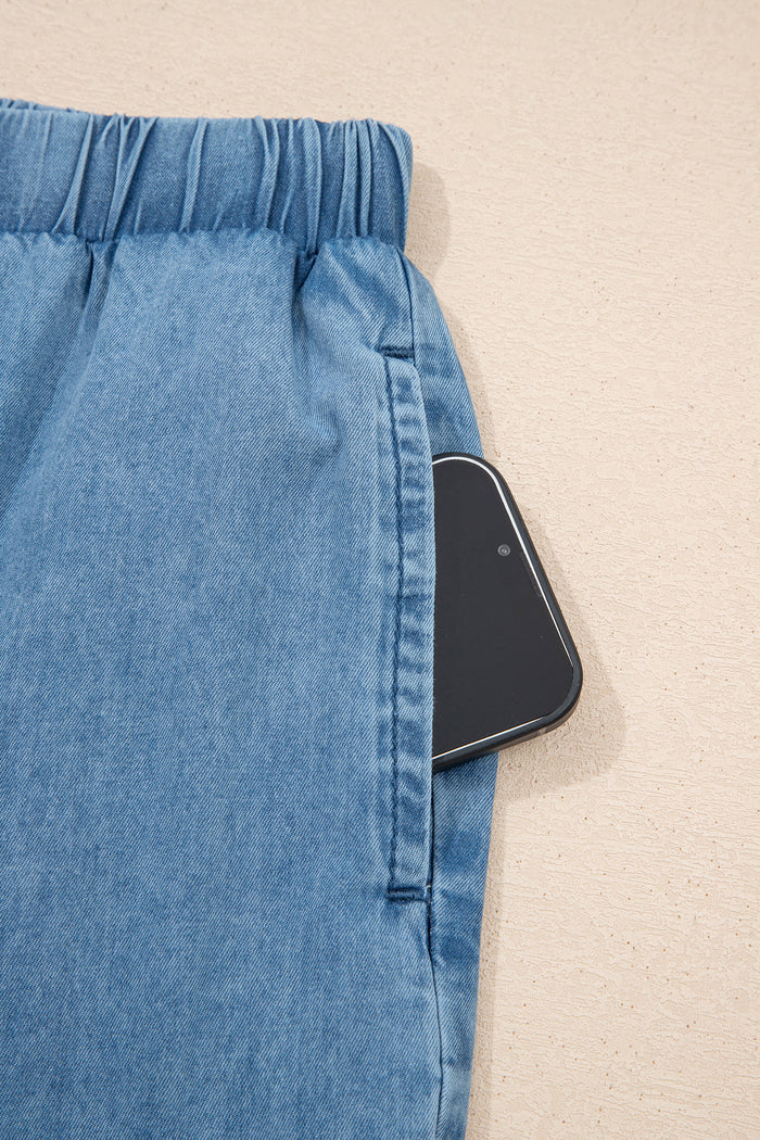 Pantalon large en chambray bleu crépuscule à ourlet volanté