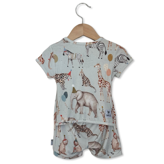 Children's outfit with animal pattern on a hanger against a white background