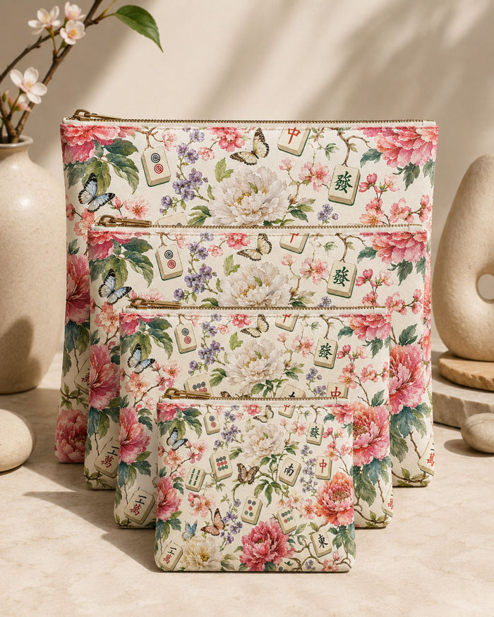 Floral vegan leather zipper pouch set with gold zipper and coordinating smaller pouch