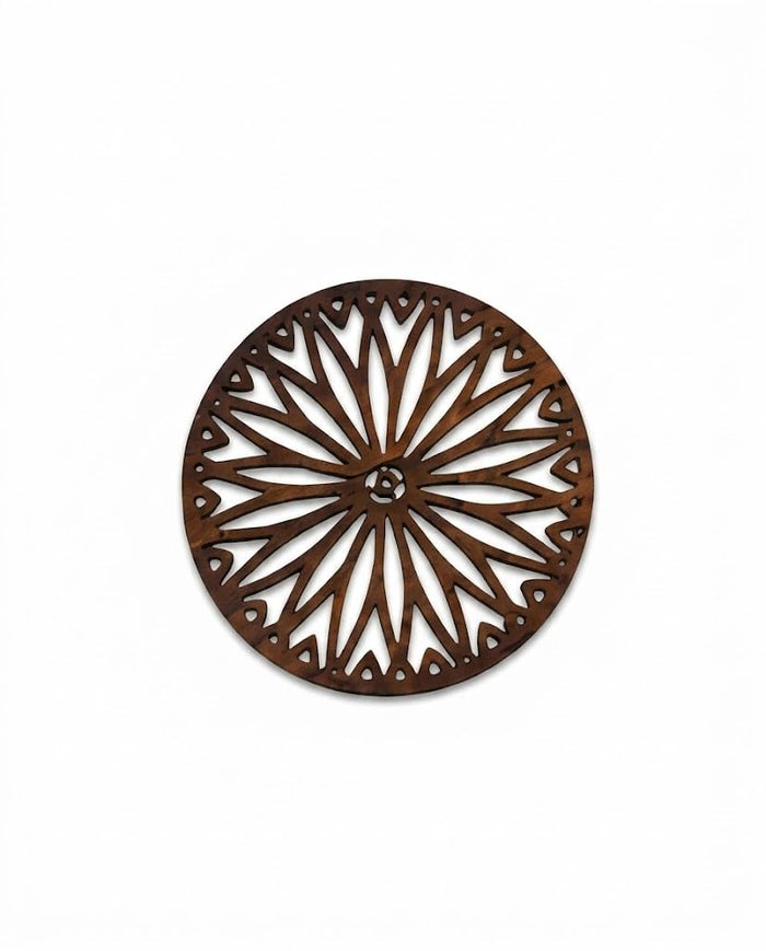 Round dark brown wooden trivet with intricate radial laser-cut pattern and central rosette