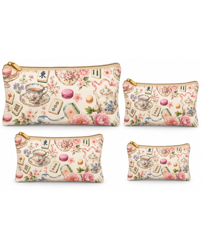 Set of tea-themed zip pouches in multiple sizes with gold zippers and pastel print.