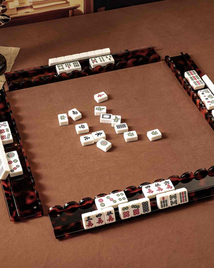 Tortoise shell acrylic mahjong tile rack set of 4 shown in a game layout