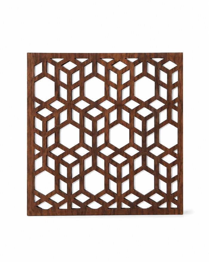 Square dark brown wooden trivet with geometric cube lattice cutout pattern