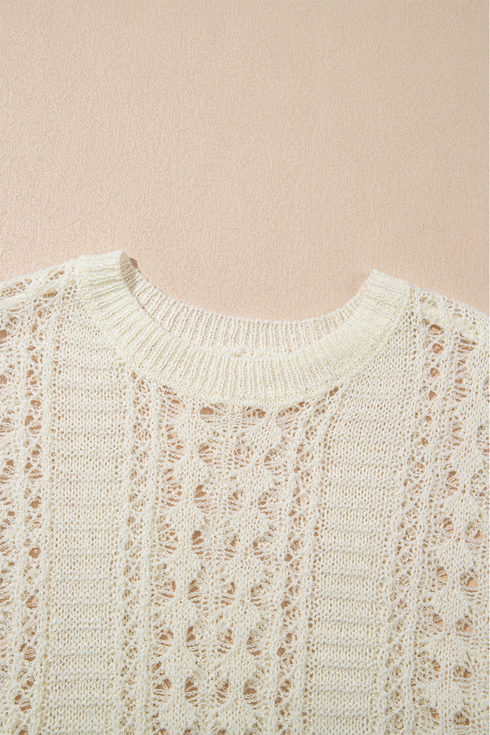 Pull blanc en tricot ajouré à manches bouffantes*