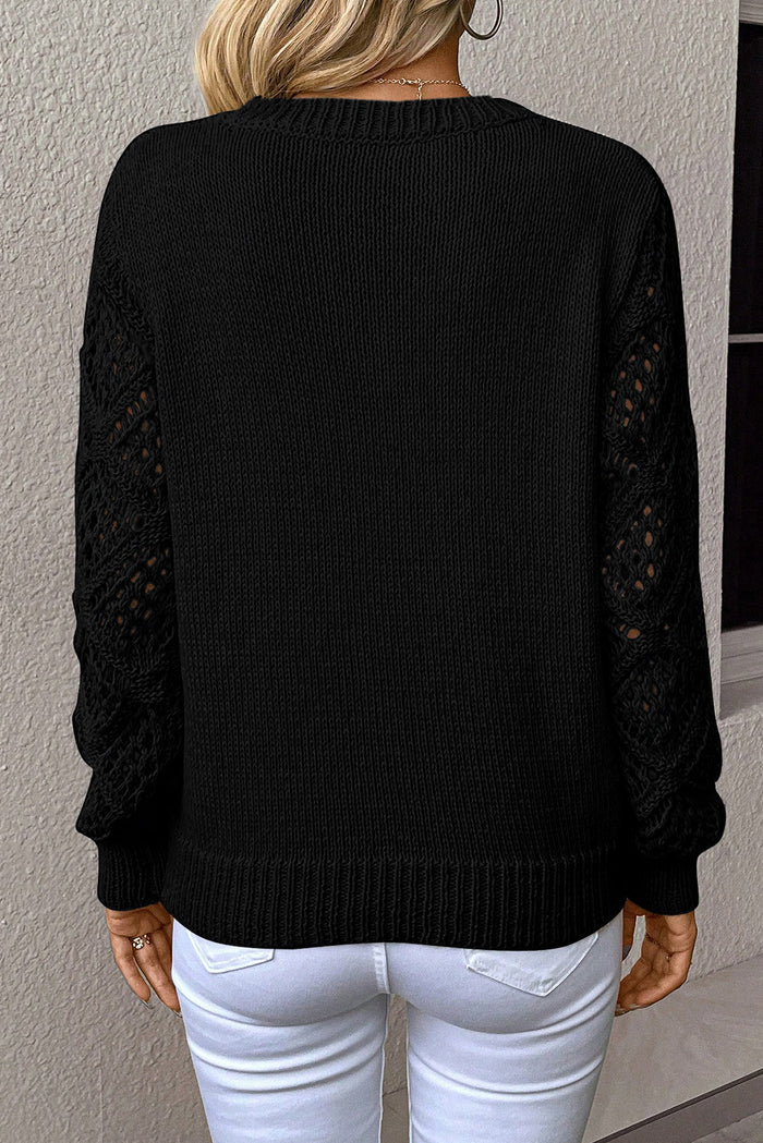 Pull patchwork noir uni à col en V et manches en tricot pointelle