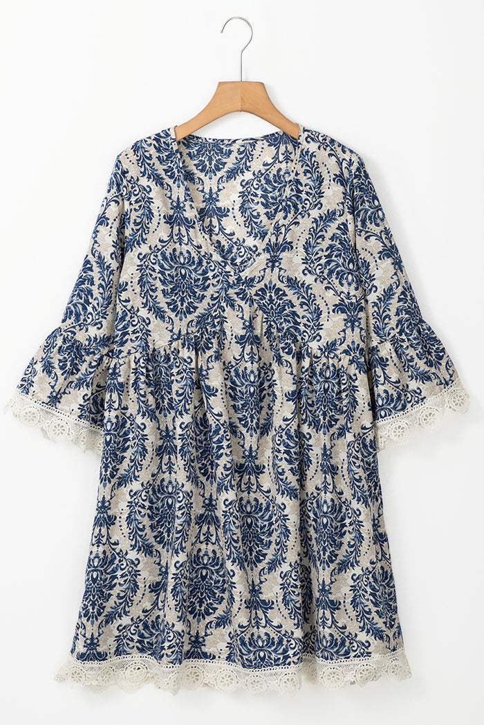 Robe ample bleu ciel à manches 3/4 et col en V *