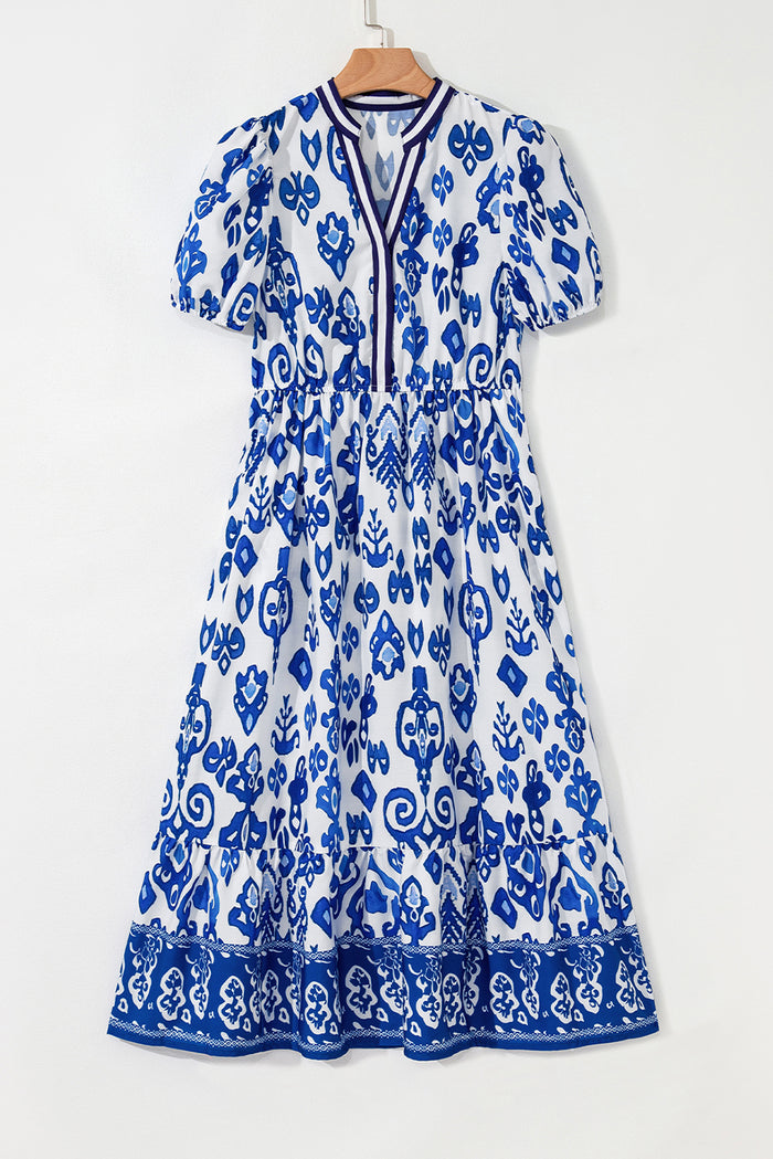 Robe longue bleue à fleurs bouffantes