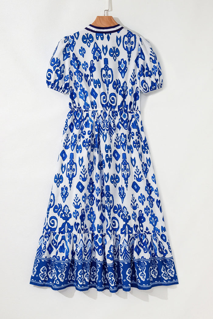 Robe longue bleue à fleurs bouffantes
