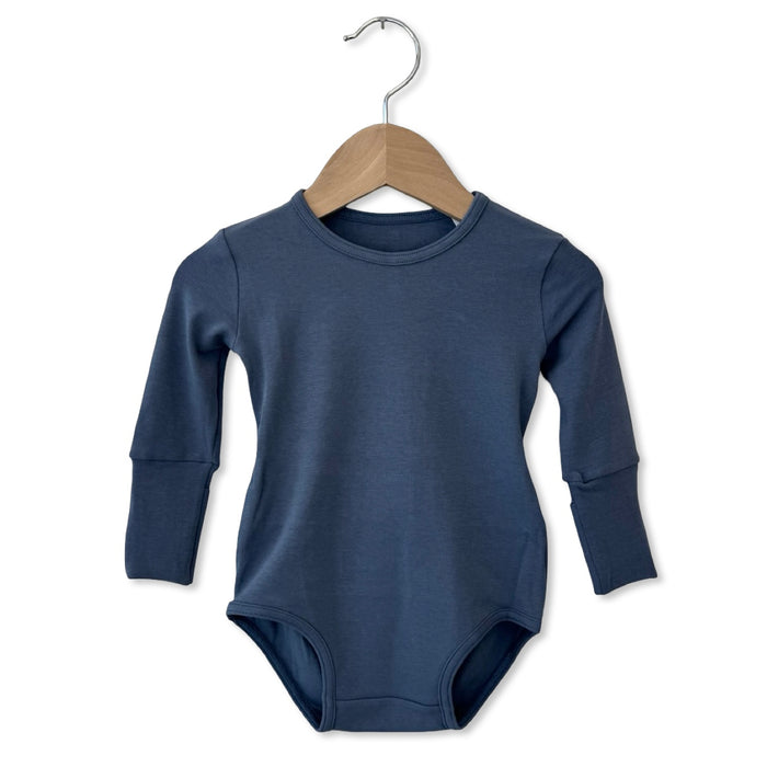Blue baby bodysuit on a wooden hanger against a white background