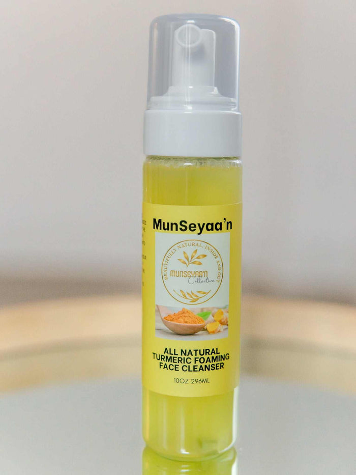 Turmeric Foaming Face Cleanser bottle with turmeric and lemon ingredients on white background