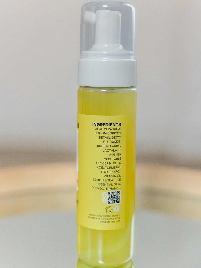 Bottle of Turmeric Foaming Face Cleanser with Kojic Acid and natural ingredients for brightening and hydrating skin