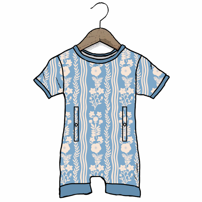 Blue baby romper with floral pattern on a hanger against a white background